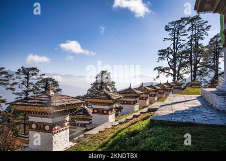 108 Druk Wangyal Chortens are lined up across Dochula Pass in honour of the fourth king, His Majesty King Jigme Singye Wangchuck. Bhutan. Stock Photo