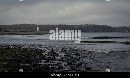 view of Maugers Beach Lighthouse from the beach on McNabs Island halifax nova scotia canada Stock Photo