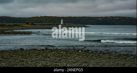 view of Maugers Beach Lighthouse from the beach on McNabs Island halifax nova scotia canada Stock Photo