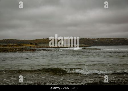 view of Maugers Beach Lighthouse from the beach on McNabs Island halifax nova scotia canada Stock Photo