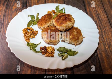 Minced pork chops fried in a pan. Stock Photo