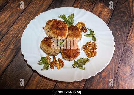 Minced pork chops fried in a pan. Stock Photo