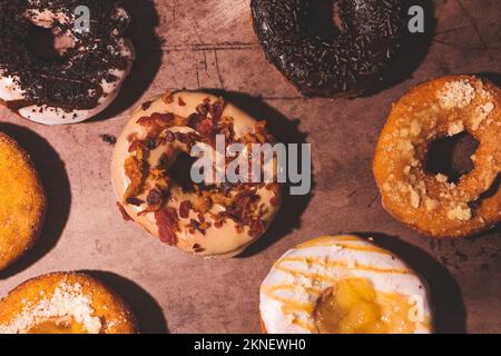 A top view of fall-themed delicious donuts - concept of sweets Stock Photo