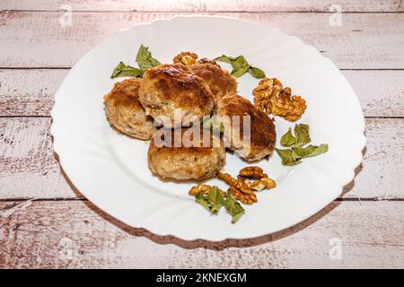 Minced pork chops fried in a pan. Stock Photo
