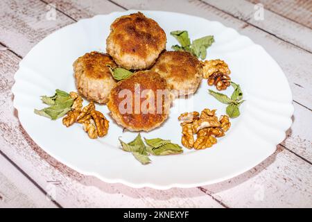 Minced pork chops fried in a pan. Stock Photo