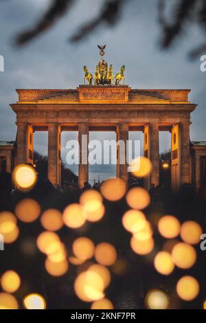 A vertical shot of Brandenburger Gate with Christmas lights. Berlin, Germany. Stock Photo