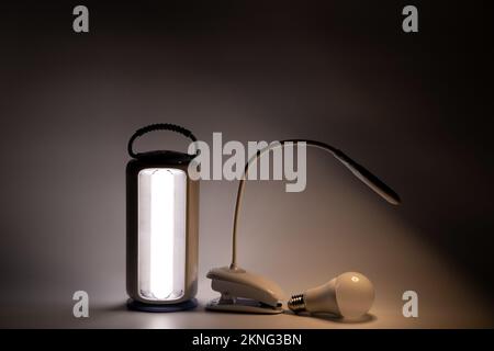 Portable and table led lamp and light bulb on white background glow in the dark without light, lamp Stock Photo