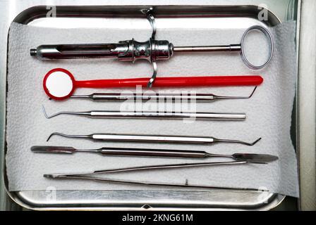 dentist tools in an iron box on the table, close up Stock Photo