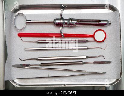 dentist tools in an iron box on the table, close up Stock Photo