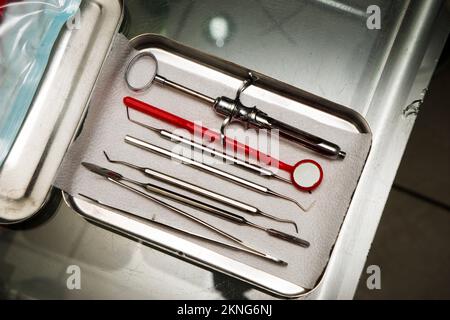 dentist tools in an iron box on the table, close up Stock Photo