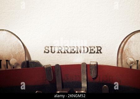 Surrender text written with a typewriter. Stock Photo