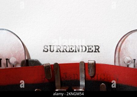 Surrender text written with a typewriter. Stock Photo