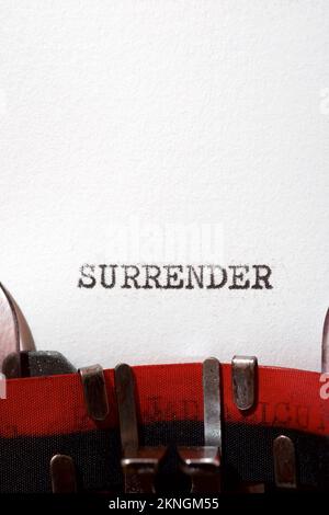 Surrender text written with a typewriter. Stock Photo