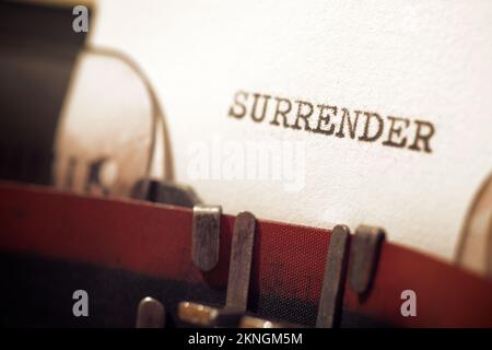 Surrender text written with a typewriter. Stock Photo