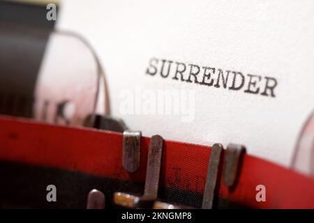 Surrender text written with a typewriter. Stock Photo