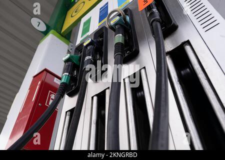 Gas station fuel pumps for different types of gasoline and diesel. Seen from below Stock Photo