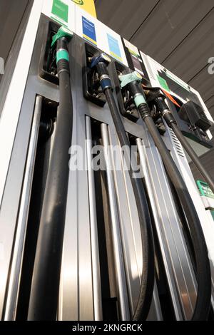 Gas station fuel pumps for different types of gasoline and diesel. Seen from below Stock Photo