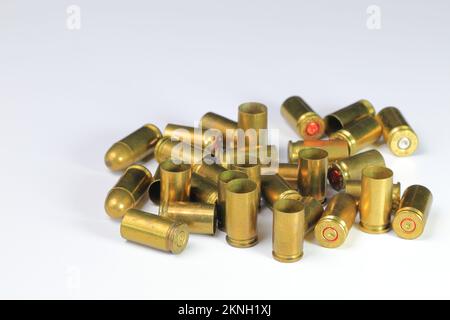 Vareity of used ammunition shells isolated on white background Stock Photo