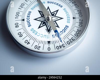 Closeup blue words "SUCCESS" on compass dial in businessman's hand on blue background. Business goal and success, plan and direction concepts with tar Stock Photo