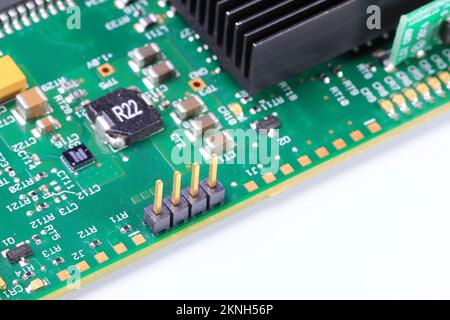 electronics circuit board with components and pin connector, 4 pin connector on the computer motherboard. Stock Photo
