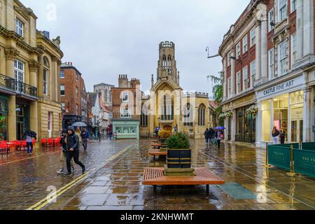 York, UK - September 22, 2022: Street scene, with the St Helen Church, locals, and visitors, in York, North Yorkshire, England, UK Stock Photo