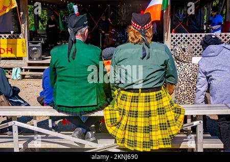 Men wear traditional Scottish kilts and Glengarries at the annual Scottish Highland Games, Nov. 13, 2022, in Gulfport, Mississippi. Stock Photo