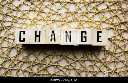 CHANGE word made from building blocks on vintage beige background Stock Photo