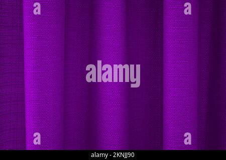 Close-up of fabric purple curtains with folds. Abstract background, curtain, drapes fabric. Stock Photo