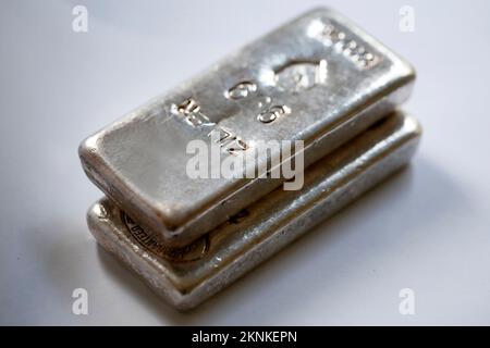 Silver ingots and a grey colored background Stock Photo