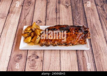 Ribs are also popular in the southern United States. They are usually cooked on the barbecue or over an open fire, and are served in pieces Stock Photo