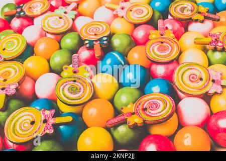 Sweet deserts in a multicolored mix of gum and wooden pops. Pop art sweets