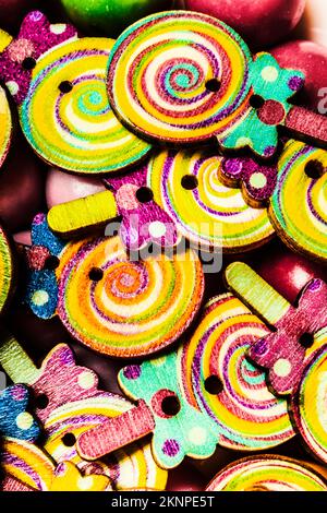Psychedelic still life on a bunch of toy candies in swirls of hypnotic sweetness