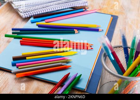 Colored pencils kept in pencil holder Stock Photo
