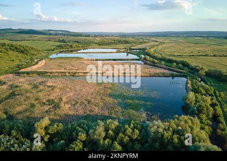 Aerial view of fish hetching pond with blue water in aquacultural area Stock Photo