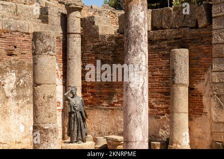 Bronze statue of the actress Margarita Xirgu between columns of the Roman theater of Merida Stock Photo