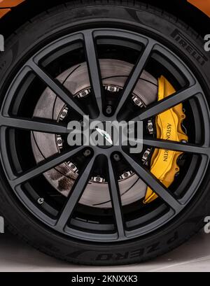 A closeup of an Aston Martin Vantage Golden Saffron black satin wheel Stock Photo