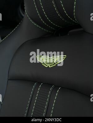 A vertical shot of the seat of an Aston Martin Vantage in black leather with lime stitching Stock Photo