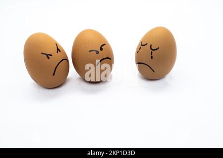 Two angry eggs and one worried Stock Photo