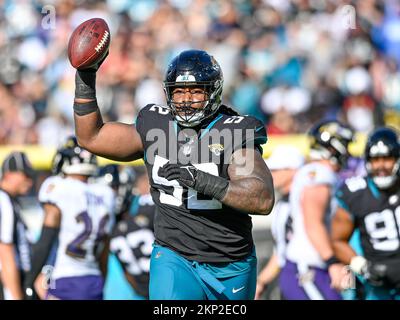 Jacksonville, FL, USA. 27th Nov, 2022. Jacksonville Jaguars defensive tackle DaVon Hamilton (52) reacts after stopping the Ravens offense on a 4th and short during a game in Jacksonville, FL. Romeo T Guzman/CSM/Alamy Live News Stock Photo