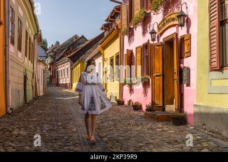Walking through the Sighisoara Old Town streets, Transylvania, Romania Stock Photo