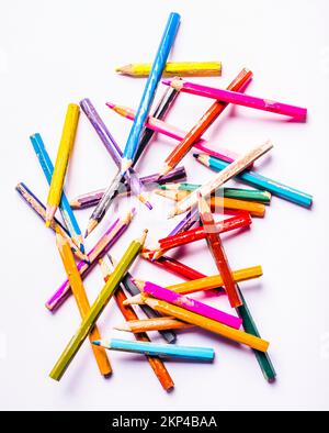 Artwork in modern still life on a vibrant variation of layered colouring pencils Stock Photo