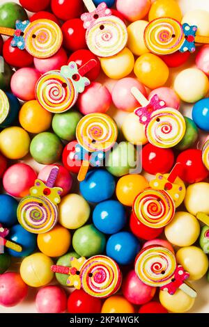 Colourful still life art on gum balls and wooden lollipops. Lolly shop pops