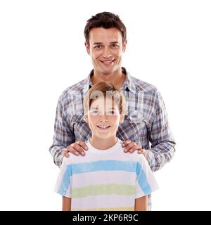Im sure the girl are gonna like him. Studio portrait of a loving father and son isolated on white. Stock Photo