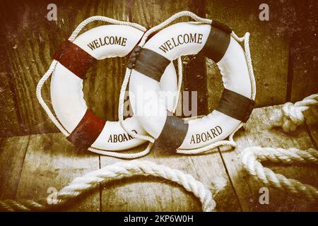 old life belt or buoy and fishing net, nautical themed decoration Stock  Photo - Alamy