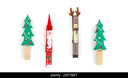 Christmas clothespins on white background isolated, flat lay. Stock Photo