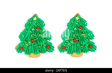 Two Christmas tree shaped cookies isolated on white background. Stock Photo