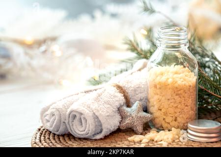 Winter spa composition with body care items and decor details. Stock Photo