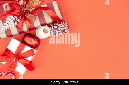 Christmas background with gift boxes and decor details, flat lay. Stock Photo