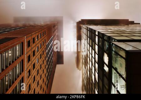 Illuminated skyscrapers in the fog at night, Japan Center left, Omniturm right, banking district, Frankfurt am Main, Hesse, Germany, Europe Stock Photo