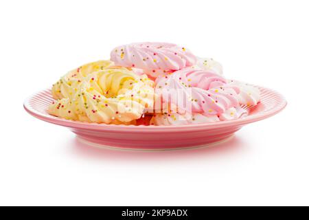 Different colors meringues with sprinkles isolated on the white background. Stock Photo